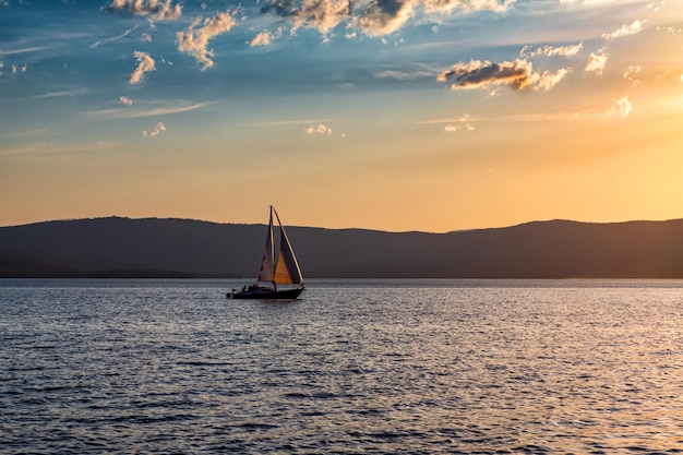 Yacht on a scenic lake in beautiful evening light