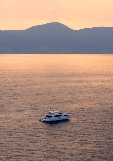 Yacht at sunset on the island of Kefalonia in the Ionian Sea in Greece