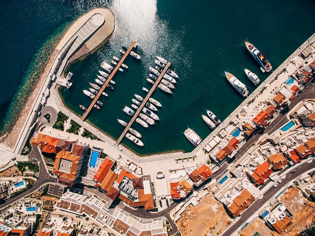 Yachts in front of the residential complex lustica bay drone