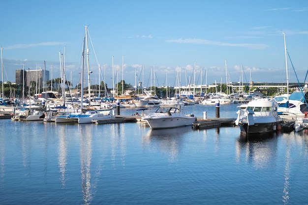 Yachts and motor boats in the port in the bay