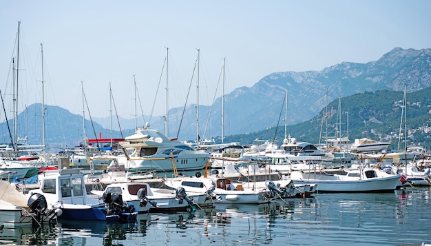 Yachts port in montenegro in adriatic sea boats pier in sunny day with beautiful mediterranean natur