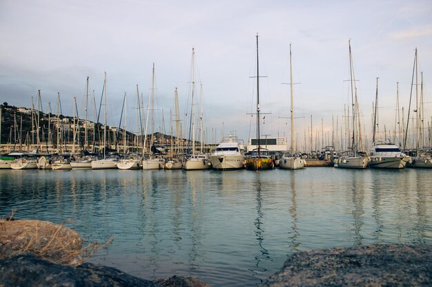 Yachts in the port sailboats modern water transport Beautiful moored sail yachts