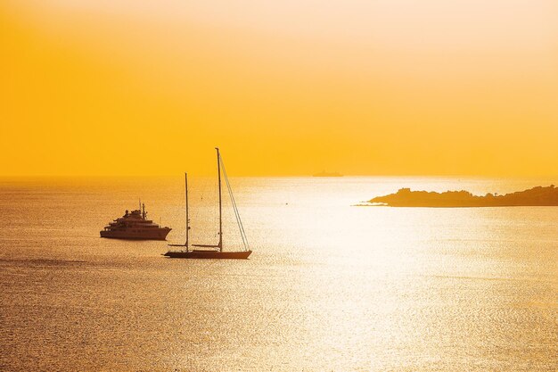 Yachts in Porto Rotondo at sunrise at the Mediterranean Sea in Costa Smeralda in Sardinia in Italy