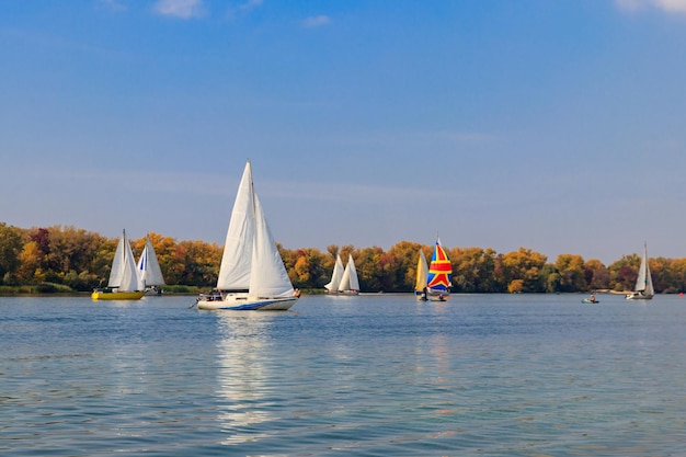 Yachts at sailing regatta on the Dnieper river in Kremenchug Ukraine