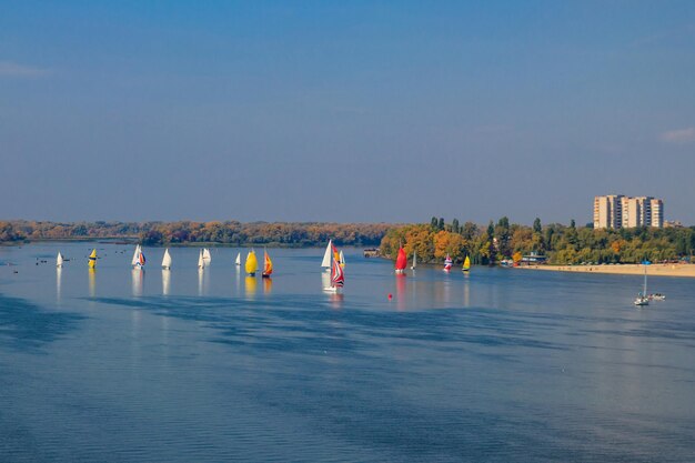 Yachts at sailing regatta on the Dnieper river in Kremenchug Ukraine