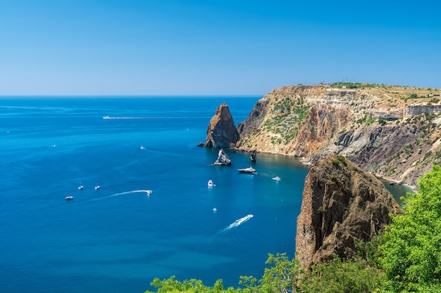 Yachts at sea in a rocky lagoon