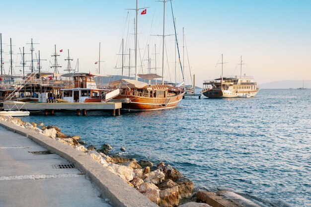 Yachts and ships in the bay of Bodrum, turquoise Aegean Sea At Sunset.