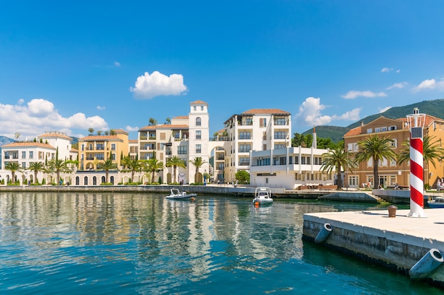 yachts of various sizes and large vessels moored in the port of Tivat.