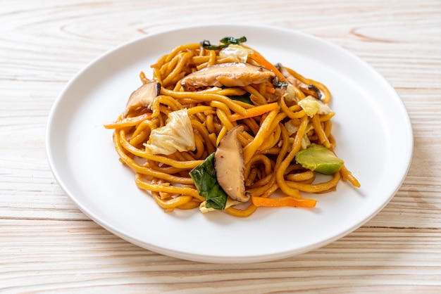 yakisoba noodles stir-fried with vegetable in asian style - vegan and vegetarian food