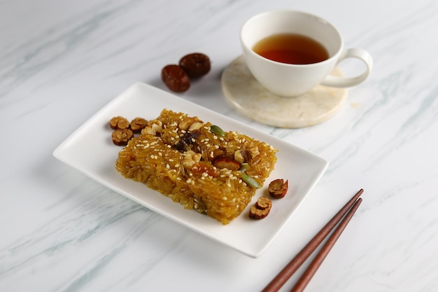Yaksik or yakbap is a tteok made from glutinous rice with chestnut jujube and pine nuts