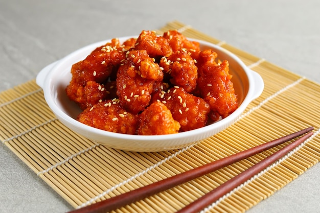 Premium Photo | Yangnyeom chicken is a fried chicken dish prepared in a