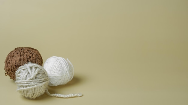 yarn for knitting on a beige background closeup