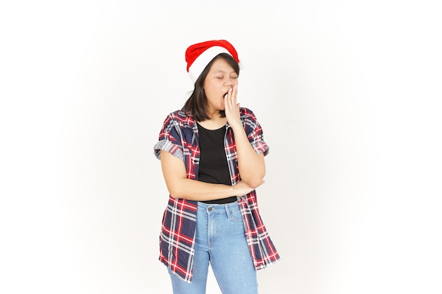 Yawning of Beautiful Asian Woman Wearing Red Plaid Shirt and Santa Hat Isolated On White Background