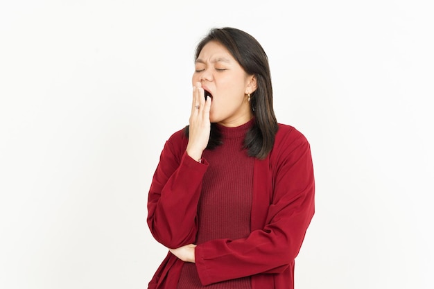 Yawning Gesture Of Beautiful Asian Woman Wearing Red Shirt Isolated On White Background