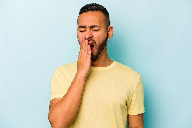 Yawning showing a tired gesture covering mouth with hand