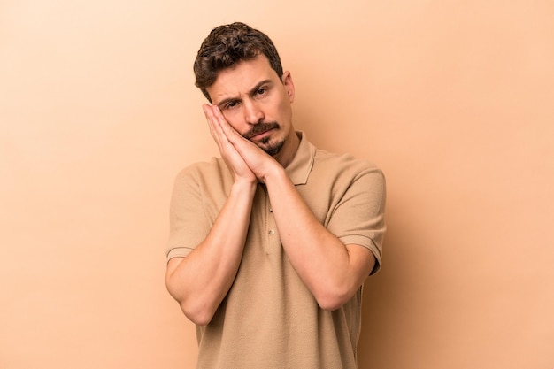 Yawning showing a tired gesture covering mouth with hand