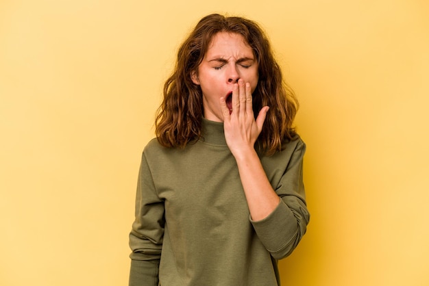 Yawning showing a tired gesture covering mouth with hand