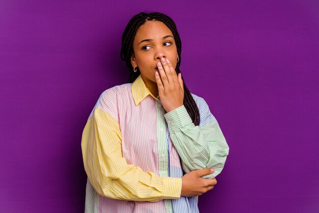 Yawning showing a tired gesture covering mouth with hand