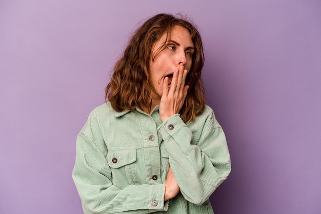 Yawning showing a tired gesture covering mouth with hand