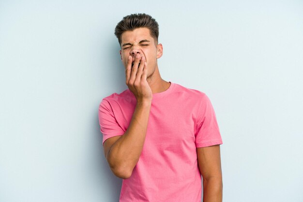 Yawning showing a tired gesture covering mouth with hand