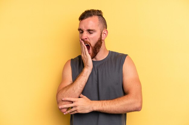 Yawning showing a tired gesture covering mouth with hand