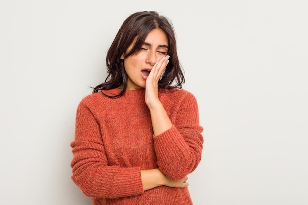 Yawning showing a tired gesture covering mouth with hand