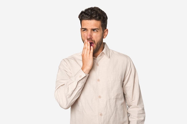 Yawning showing a tired gesture covering mouth with hand