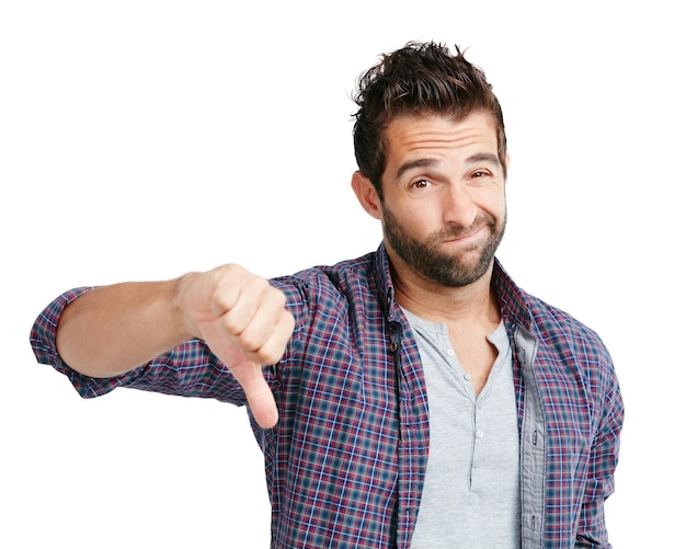 Yeah maybe next time Studio shot of a young man showing thumbs down against a white background