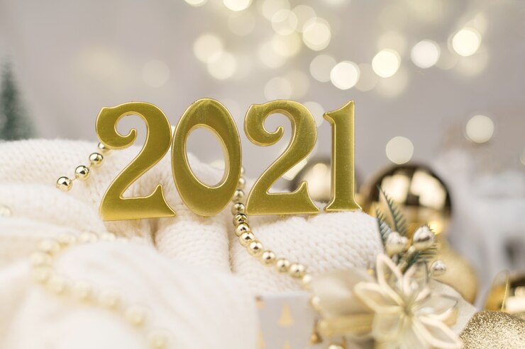 Photo year 2021 numbers on golden bokeh background new year mood, christmas, greeting card, new year background