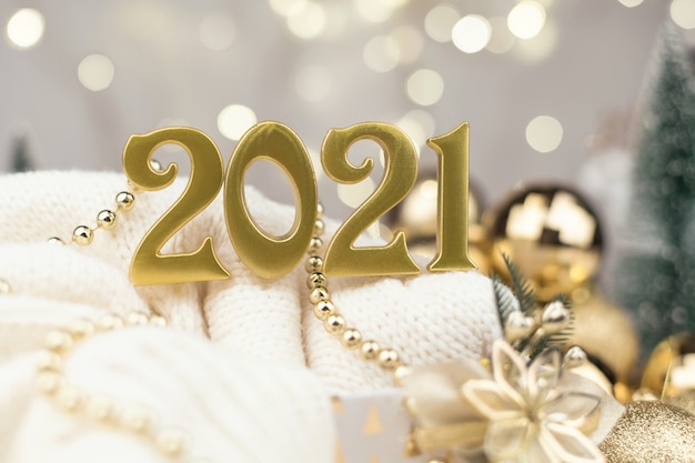 Year 2021 numbers on Golden bokeh background New year,