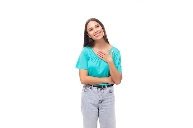 year old attractive brunette woman with flowing straight hair put on a blue tshirt and jeans