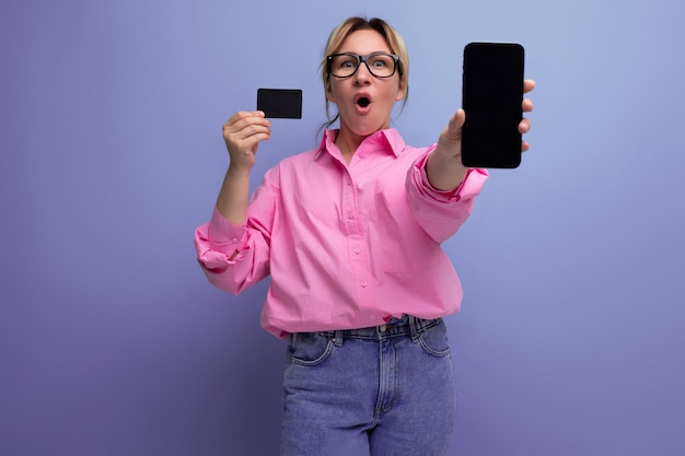 year old pretty caucasian blond leader careerist woman with ponytail and glasses uses internet