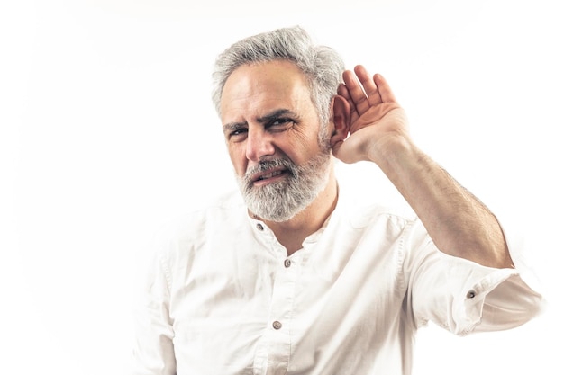 Photo years old gray haired man listening with hand over ear isolated studio shot