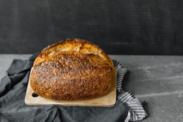 Yeastfree sourdough bread a beautiful European woman baker holds bread in her hands bake bread