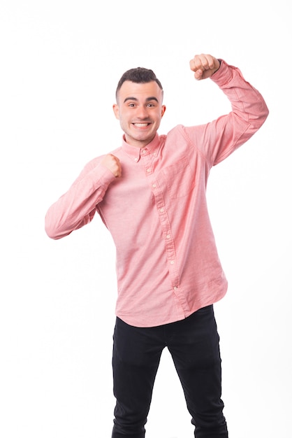 YEESSS ! Photo of excited young guy, celebrating his succes over white isolated space