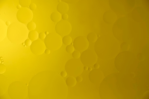 Yellow abstract background with oil circles streaks and gradient