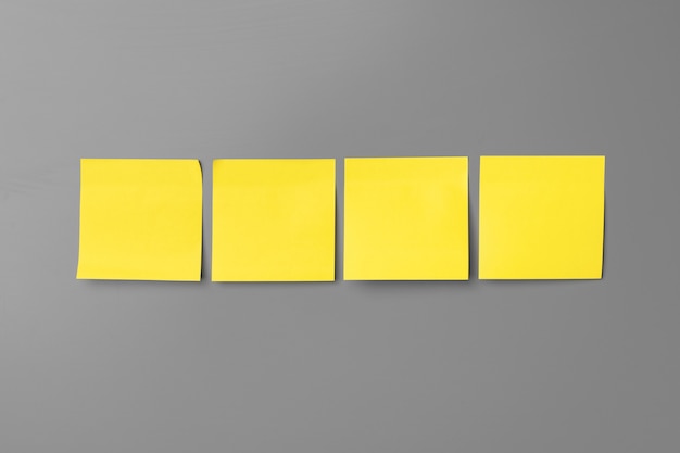 Photo yellow adhesive notes on gray background