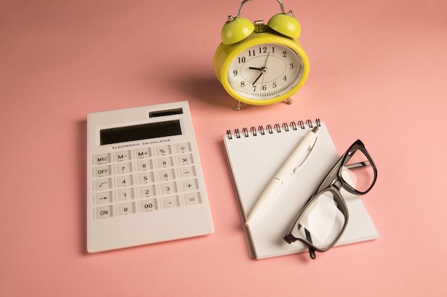 Yellow alarm clock calculator and notepad