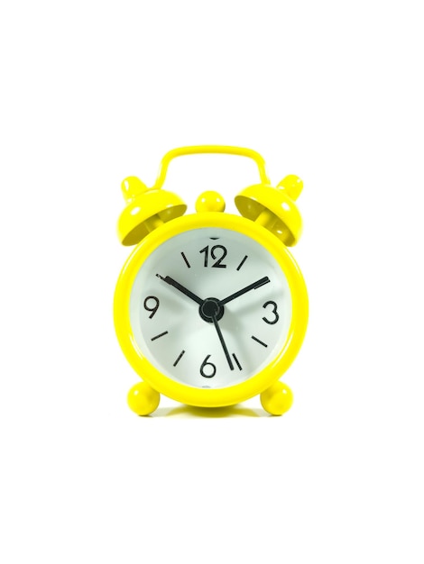 コピー スペースで白い背景に分離された黄色の目覚まし時計