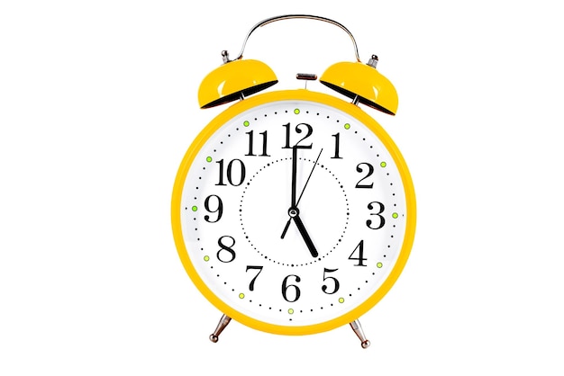 Yellow alarm clock isolated on the white background