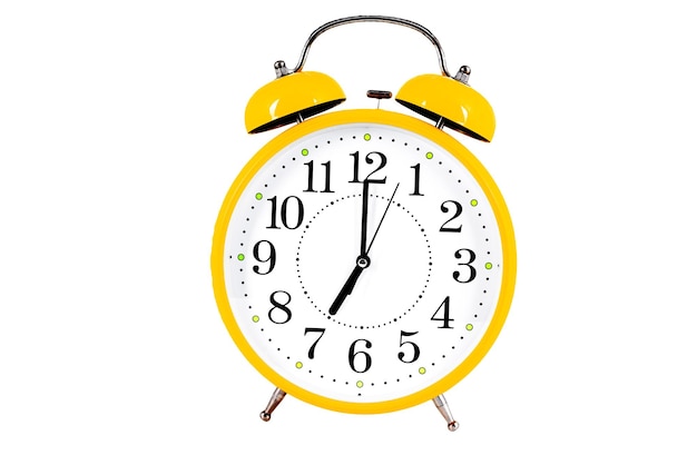 Yellow alarm clock isolated on the white background