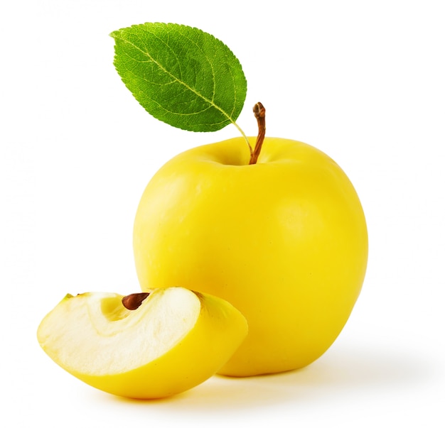 Yellow apple with a slice and leaf