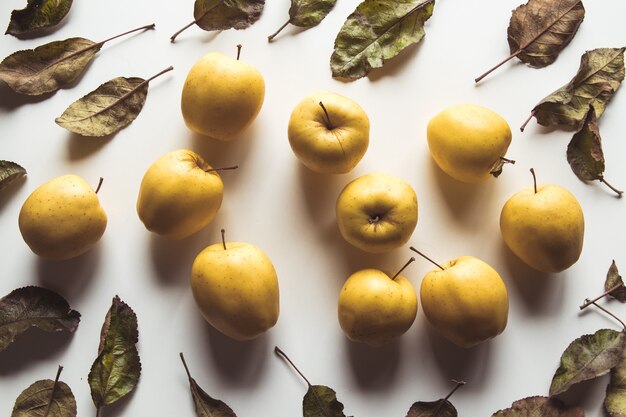 Yellow apples on a white background, wholesome food, farming, vegetarian