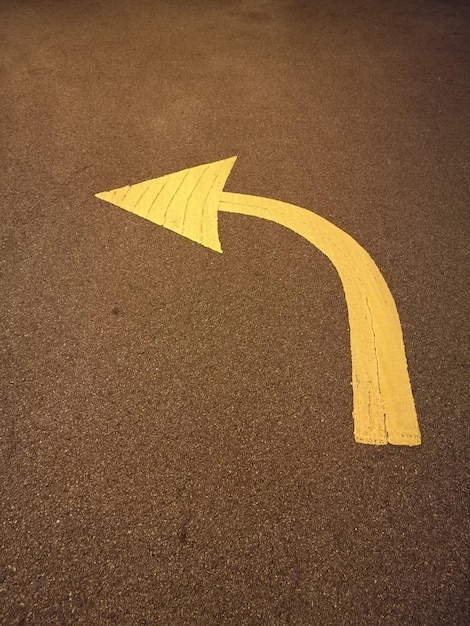 Photo yellow arrow symbol on road