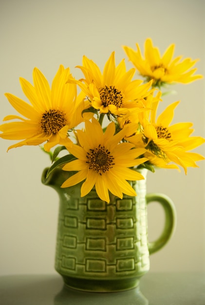 Yellow Asters in Green Dish