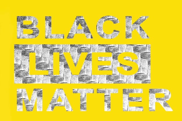 Photo on a yellow background. the inscription black lives matter with texture