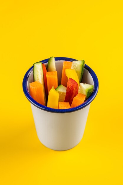 Yellow background and mango with watermelon fresh fruit salad strawberry kiwi mango grape