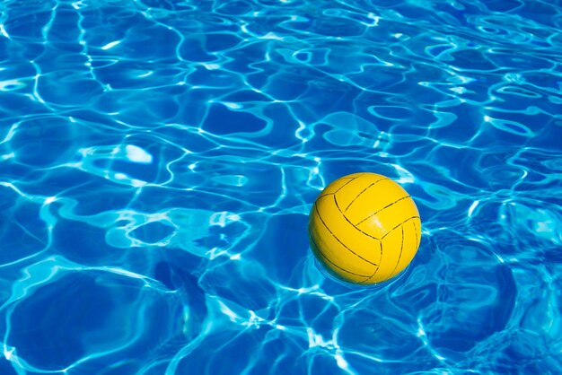 Yellow ball in the pool