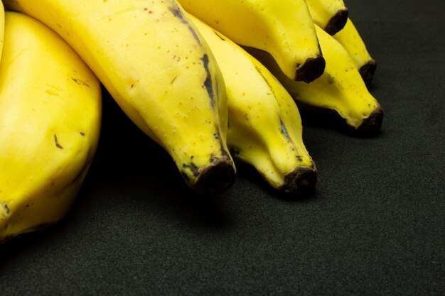 yellow Banana bunch on a black background