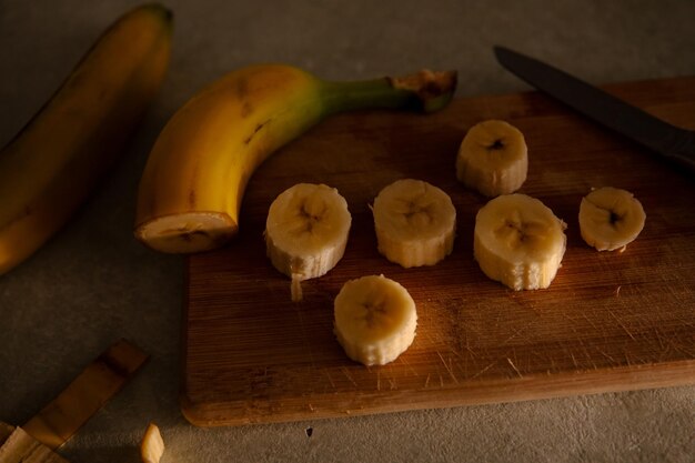 Yellow banana on a kitchen table cut into pieces